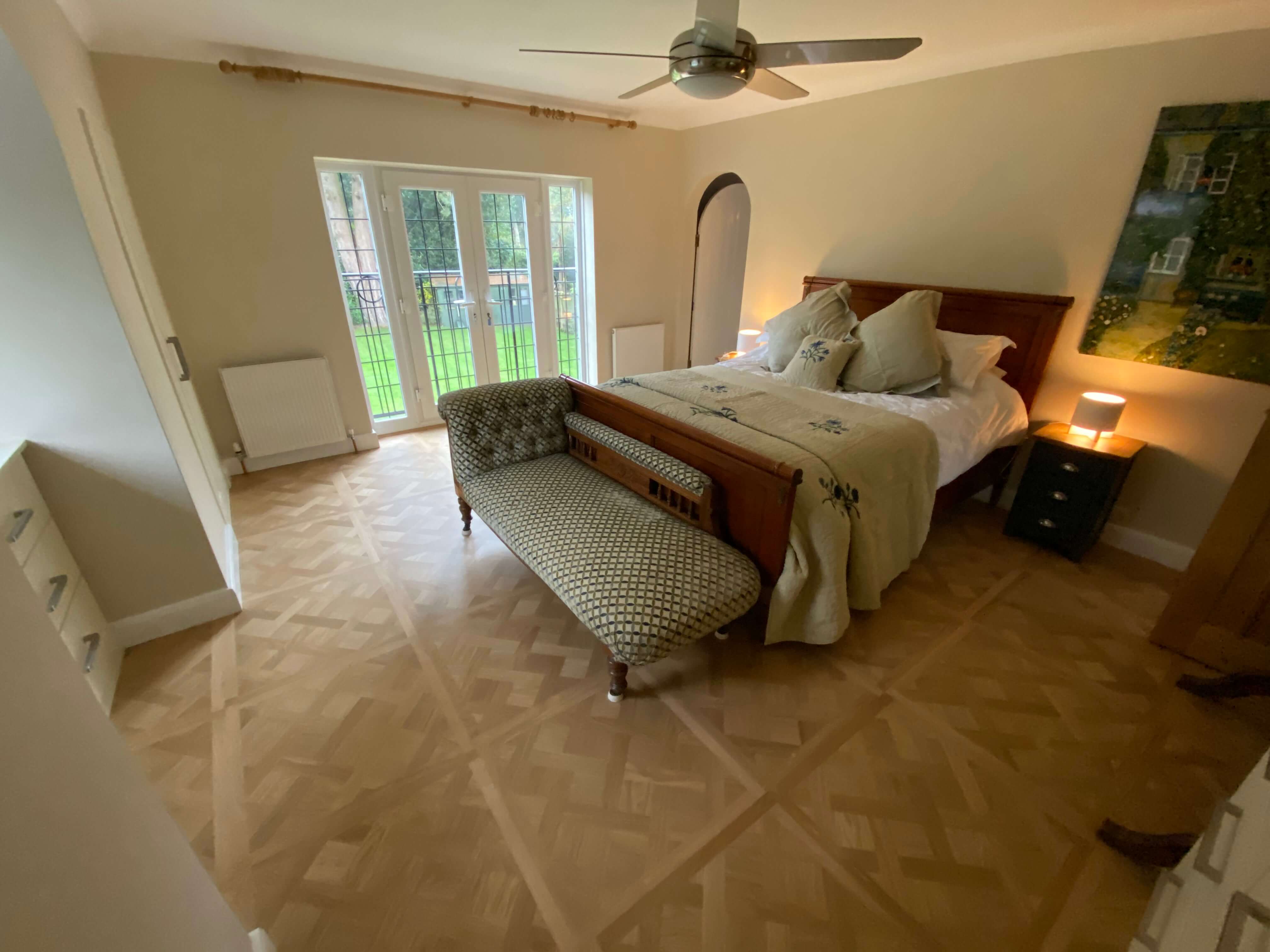Versailles wood flooring panels in bedroom